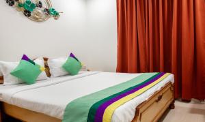 Katil atau katil-katil dalam bilik di Treebo Y Hotels Elite, Khandagiri
