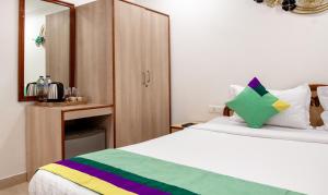 Katil atau katil-katil dalam bilik di Treebo Y Hotels Elite, Khandagiri