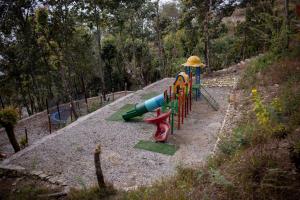 a childrens playground with a slide at Naya Gaun Eco Resort in Pokhara