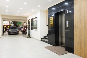 a hallway of a building with a revolving door at V V Grand in Chennai