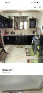 a kitchen with a sink and a counter top at Hidden oasis in Mandeville