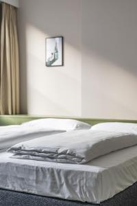 Postel nebo postele na pokoji v ubytování Hotel Goldener Stern - contactless check-in