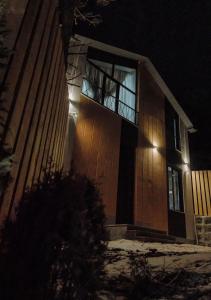 a house with an open window at night at Moonlight in Tsaghkadzor