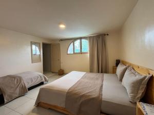 Uma cama ou camas num quarto em Riad Dar Naima Imsouane