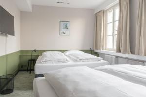 Postel nebo postele na pokoji v ubytování Hotel Goldener Stern - contactless check-in