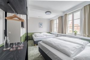 Postel nebo postele na pokoji v ubytování Hotel Goldener Stern - contactless check-in
