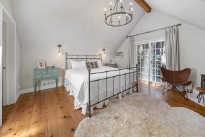 a bedroom with a bed and a desk and a chair at Yellowdog Inn in Arnold