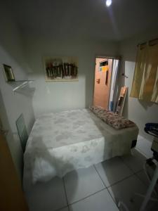 a bedroom with a large bed in a room at Flat imobiliado feitosa in Maceió