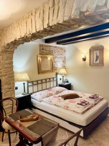 a bedroom with a bed and a table at Apartment Venus of the Palace - NEW RENOVATED in Split