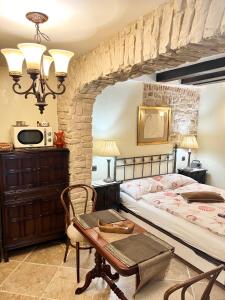 a bedroom with a bed and a table at Apartment Venus of the Palace - NEW RENOVATED in Split