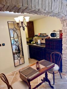 a kitchen with a table and a mirror at Apartment Venus of the Palace - NEW RENOVATED in Split