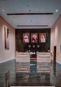 a room with three display cases in a building at حيات الفرسان الفندقية in Al Qurayyat