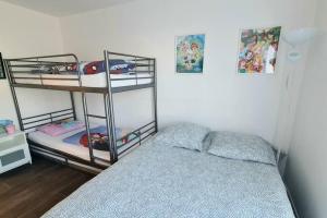 a bedroom with two bunk beds and a bed at ❀ Disneyland Paris, Résidence Privée dans Centre ❀ in Chessy