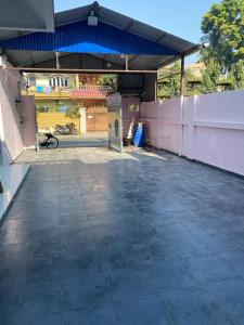 an empty parking lot in a building with a fence at Royalwood City Inn in Birātnagar