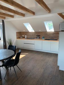 Kuchyň nebo kuchyňský kout v ubytování Apartement Lujzi