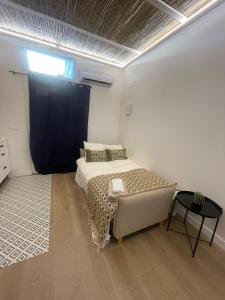 A bed or beds in a room at casa Albufera boutique
