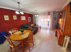 a living room with a table and a couch at Apartamento Vista Atlántico in Adeje