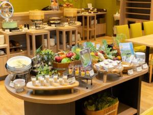 a table filled with lots of fruits and vegetables at APA Hotel TKP Sendai Eki Kita in Sendai