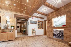 a large room with wooden walls and wooden floors at Villa Adria B&B in Canazei