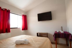 Postel nebo postele na pokoji v ubytování Cochito Cusco
