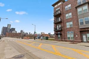 an empty street in a city with a brick building at Affordable 2-Bedroom DT Detroit. in Detroit