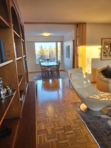 a living room with a couch and a table at Large apartment with 4 bedrooms, central location in Tampere