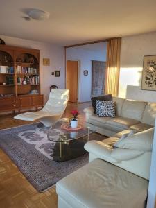 a living room with a couch and a table at Large apartment with 4 bedrooms, central location in Tampere