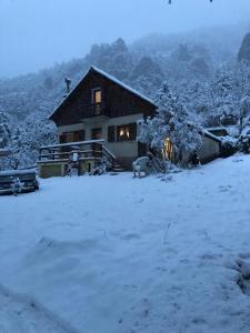 a house in the snow in front at Chalet proche Valberg in Guillaumes