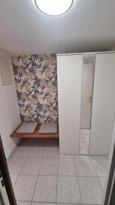 a bathroom with two stalls and a mirror at Joli T2 proche mer et commodités in La Seyne-sur-Mer