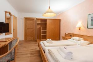 Postel nebo postele na pokoji v ubytování Resort Amadeus-Landhaus Amadeus