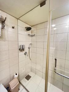 a bathroom with a shower and a toilet at Mabelle s Room with Gym and Bar in Jounieh