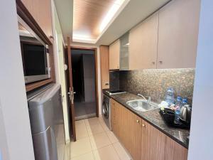 a kitchen with a sink and a dishwasher at Maria s Single Room with Gym and Bar in Jounieh