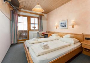 Postel nebo postele na pokoji v ubytování Resort Amadeus-Landhaus Amadeus