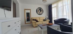 a living room with a couch and a table at Estepona Center in Estepona