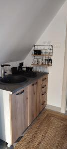 a kitchen with a sink and a counter top at Mountain inn in Žabljak