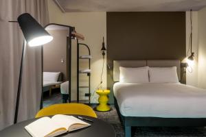 Postel nebo postele na pokoji v ubytování ibis Saint Paul Trois Chateaux