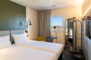Postel nebo postele na pokoji v ubytování ibis Saint Paul Trois Chateaux + 37 fotografií