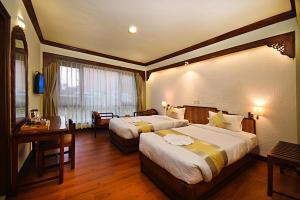 Ένα ή περισσότερα κρεβάτια σε δωμάτιο στο Nirvana Boutique Hotel