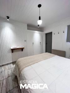 Una cama o camas en una habitación de Hotel Termas Lahuen-Có