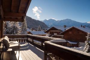 a balcony with a view of a snow covered mountain at La Ruinette- Stylish 4-bed, Centre Of Verbier in Verbier