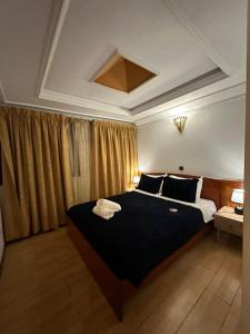 Een bed of bedden in een kamer bij Amrouss touristic DarMaroc