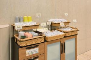 a counter with wicker baskets on top at Hotel NCB in Osaka