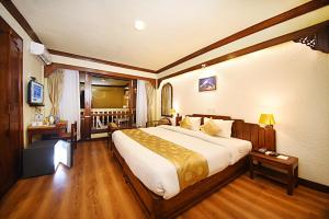 Ένα ή περισσότερα κρεβάτια σε δωμάτιο στο Nirvana Boutique Hotel
