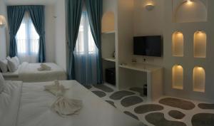 Voodi või voodid majutusasutuse Ipoh Santorini Hideaway - Hotel Inspired toas