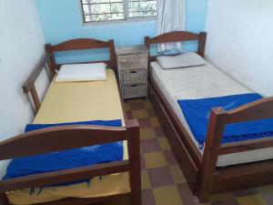 a bedroom with two bunk beds and a dresser at Terrazas del Palomar in Salto