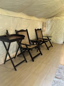 two chairs and a table in a tent at Ales & Juli in Morjim