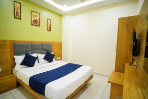 Postel nebo postele na pokoji v ubytování Hotel Suncity