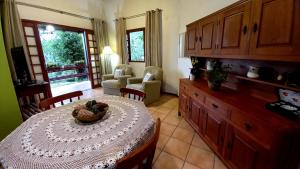 a kitchen with a table with a bowl of fruit on it at Casa Vista Panorâmica in Florianópolis