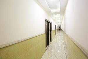 a hallway of an empty building with a long corridor at Hotel De Kiara Near Delhi Airport in New Delhi