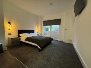a bedroom with a large bed and a window at Seafarers Stays in Southampton +54 photos